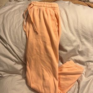 Fabletics eco go to classic sweatpants in coral